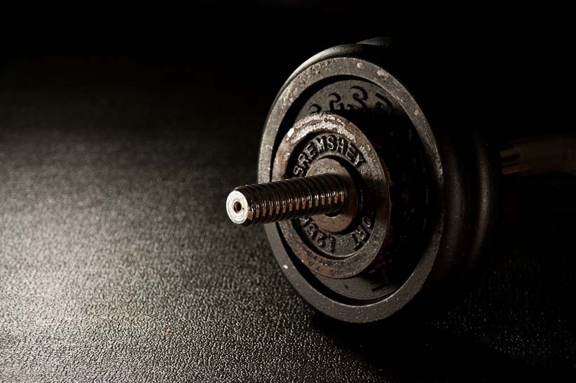 fitness-barbell for strength training on floor