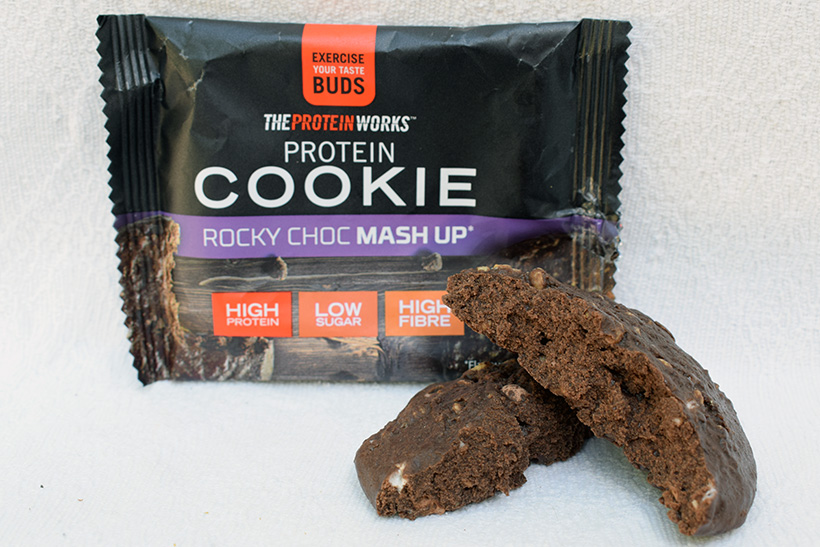 The protein works protein snacks Protein cookie Rocky Choc Mashup Flavour packaging and inside cookie