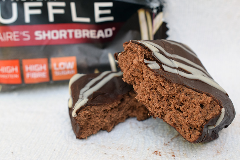 The protein works protein snacks Protein truffle millionaires shortbread packaging and truffle closeup