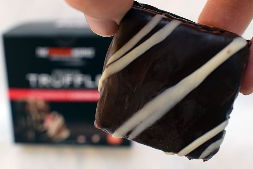 The protein works protein snacks Protein truffle strawberry cheesecake flavour box of 12 and strawberry cheesecake truffle